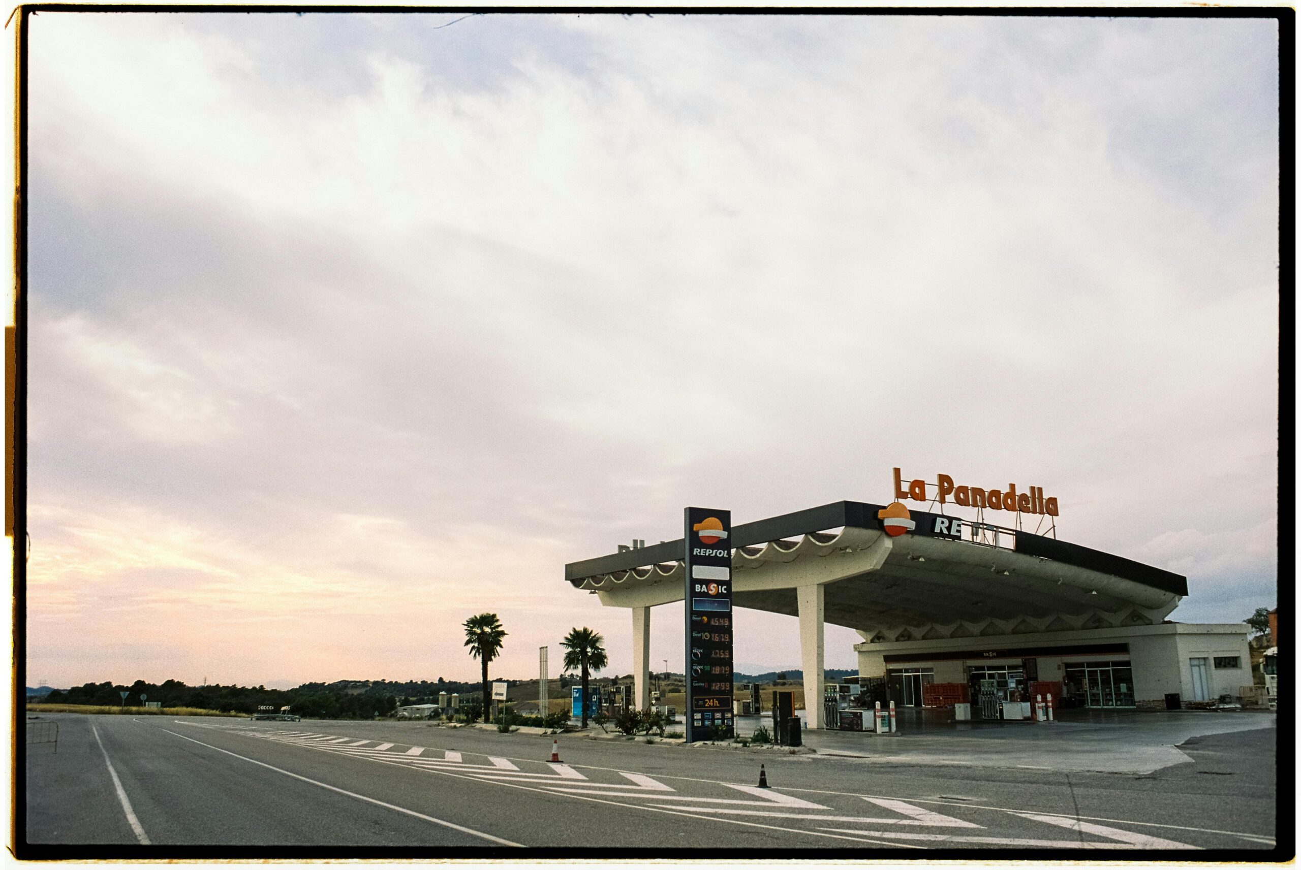 View of Repsol gas station at La Panadella, Spain under an expansive sky.